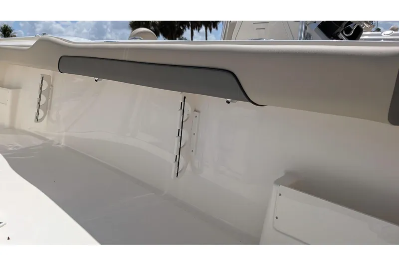 Slide: The Image of Interior view of 2026 Key West 239 FS boat, featuring sleek white design and storage compartments. - 12