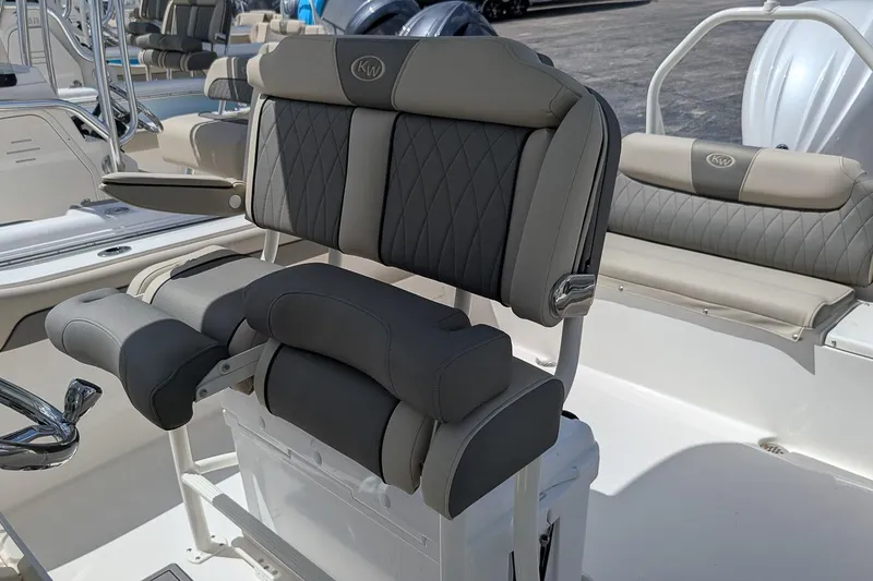 Slide: The Image of 2026 Key West 239 FS boat interior with cushioned seating and modern design. - 14