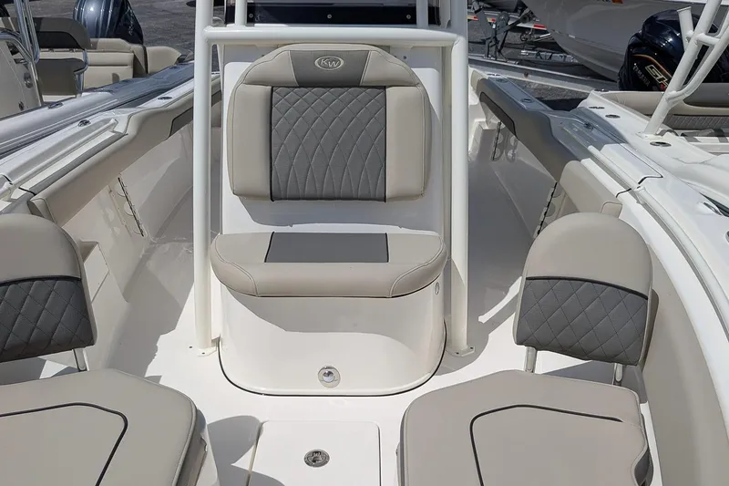 Slide: The Image of 2026 Key West 239 FS boat interior with cushioned seating and modern design. - 18