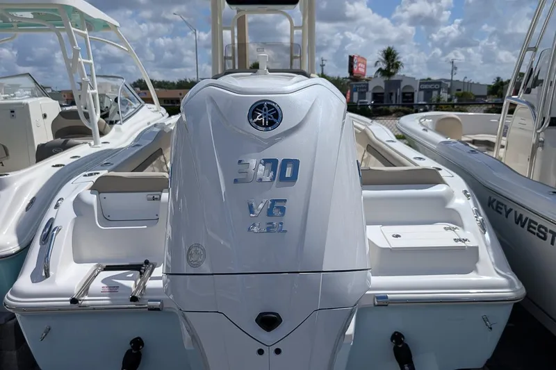 Slide: The Image of 2026 Key West 239 FS boat with Yamaha 300 V6 engine, displayed outdoors. - 4
