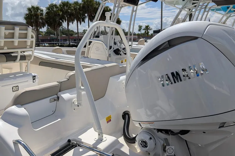 Slide: The Image of 2026 Key West 239 FS boat with Yamaha engine, featuring sleek interior and palm trees in background. - 6