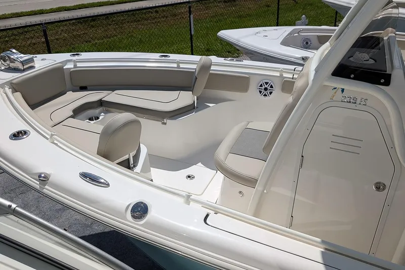 Slide: The Image of 2026 Key West 239 FS boat interior with seating and console, showcasing modern design. - 8