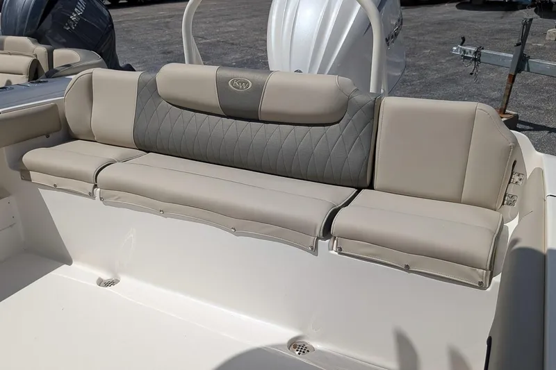 Slide: The Image of 2026 Key West 239 FS boat with beige and gray cushioned seating. - 9