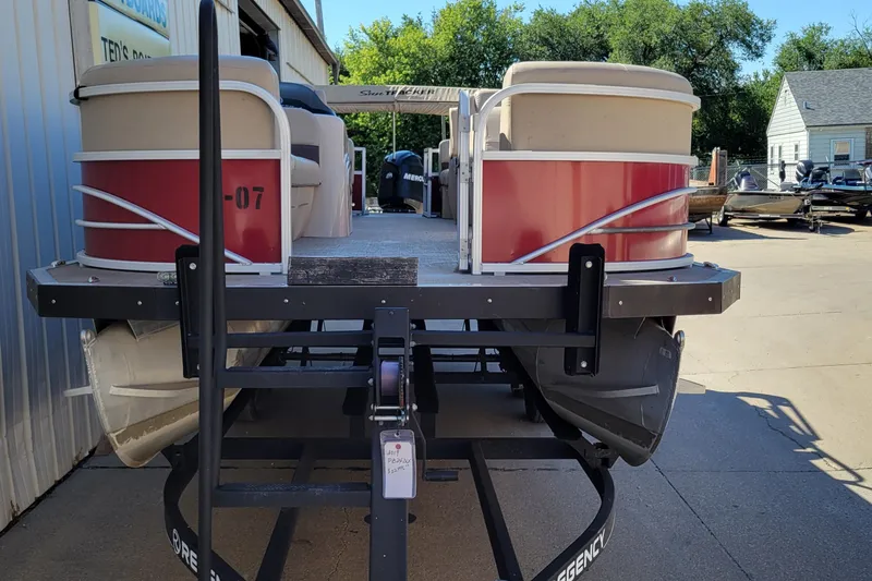 Slide: The Image of 2019 Sun Tracker Party Barge 24 DLX pontoon boat on trailer outside dealership. - 2