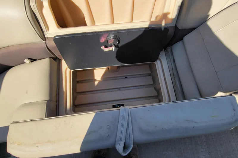 Slide: The Image of 2019 Sun Tracker Party Barge 24 DLX with beige seating and canopy, docked outdoors. - 22