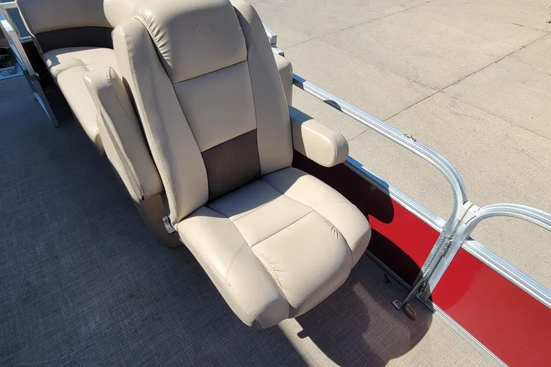 Slide: The Image of 2019 Sun Tracker Party Barge 24 DLX beige seating with armrest on deck. - 33