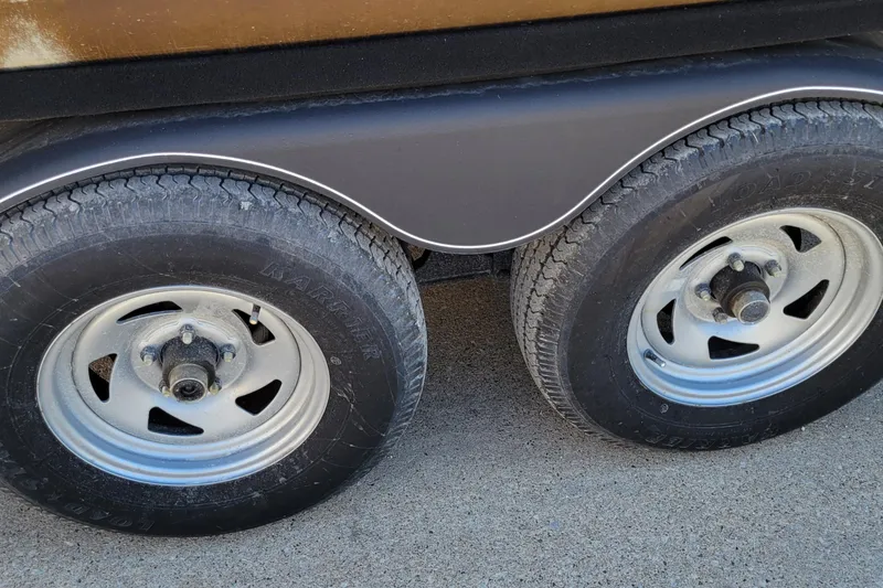 Slide: The Image of 2019 Sun Tracker Party Barge 24 DLX on trailer in outdoor lot. - 7