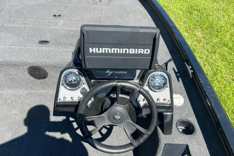 Slide: The Image of 2019 Lowe Stinger 175C boat dashboard with Humminbird fish finder and steering wheel. - 11