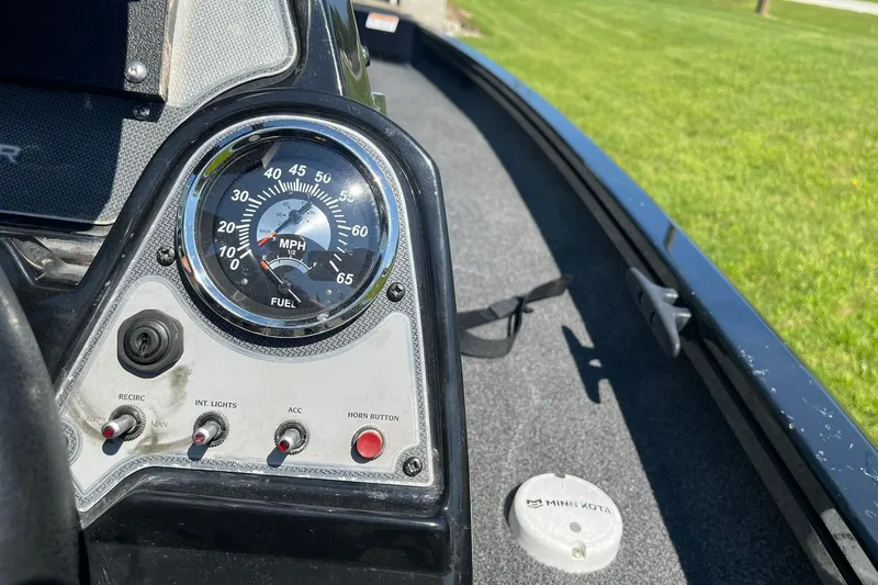 Slide: The Image of Dashboard of a 2019 Lowe Stinger 175C boat with speedometer and control switches. - 15