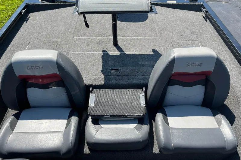 Slide: The Image of 2019 Lowe Stinger 175C boat interior with two gray seats and a central platform. - 19