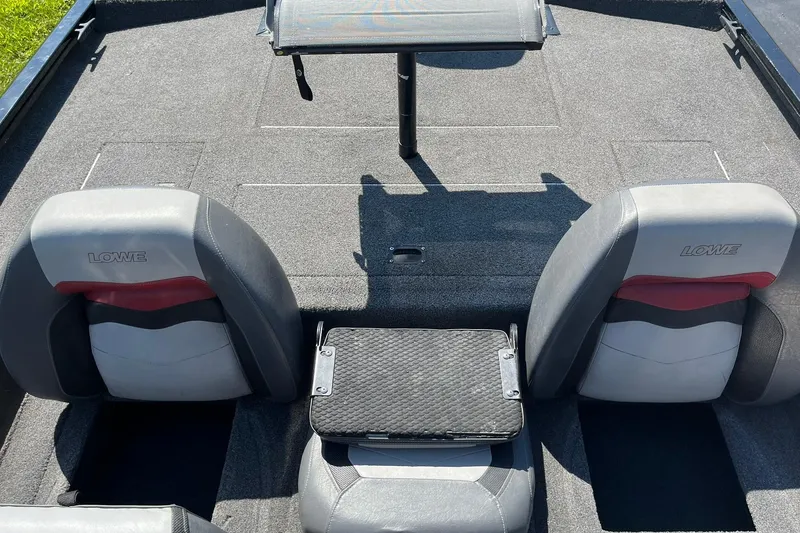 Slide: The Image of 2019 Lowe Stinger 175C boat interior with two seats and a central platform. - 20
