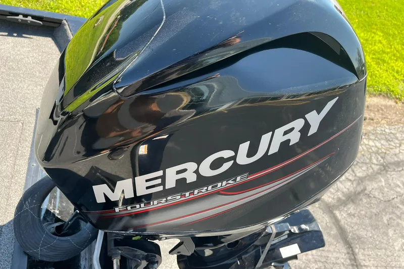 Slide: The Image of Mercury FourStroke engine on 2019 Lowe Stinger 175C boat, close-up view. - 24