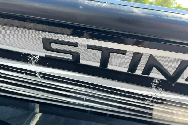 Slide: The Image of Close-up of 2019 Lowe Stinger 175C boat logo with metallic finish. - 32