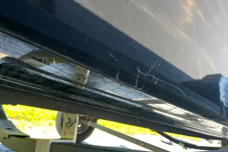 Slide: The Image of 2019 Lowe Stinger 175C boat with visible scratches on the hull. - 34