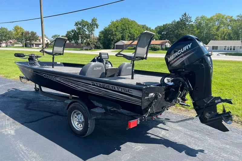Slide: The Image of 2019 Lowe Stinger 175C boat with Mercury outboard motor on a trailer. - 5