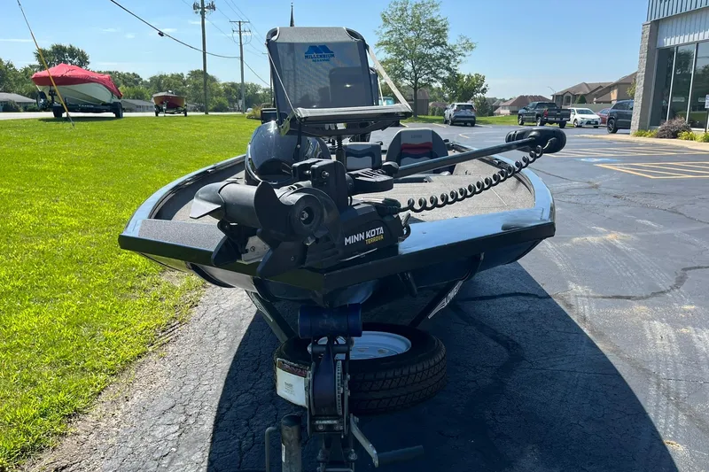 Slide: The Image of 2019 Lowe Stinger 175C boat with Minn Kota trolling motor on a sunny day. - 6