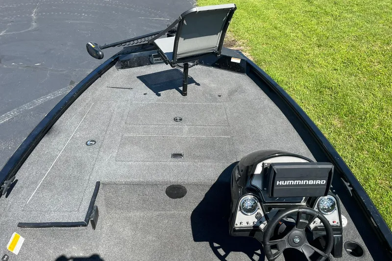 Slide: The Image of 2019 Lowe Stinger 175C boat interior with Humminbird system and fishing seat. - 8