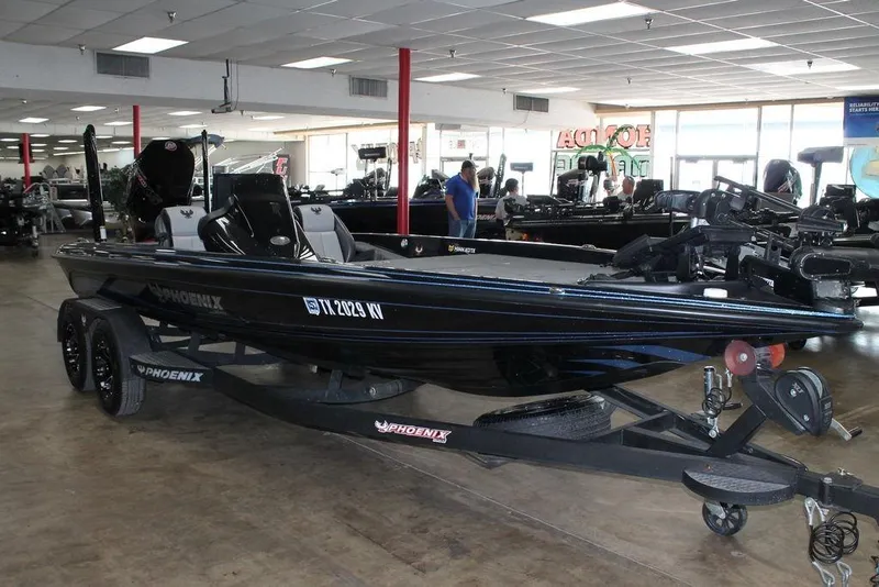 Slide: The Image of 2024 Phoenix 721 Pro XP boat displayed in a showroom, featuring sleek design and modern equipment. - 5