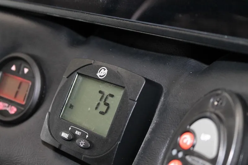 Slide: The Image of Close-up of 2024 Phoenix 721 Pro XP dashboard with digital display showing 75. - 6