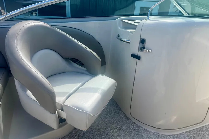 Slide: The Image of 2003 Searay 220 Sundeck interior with gray seating and sleek design. - 14
