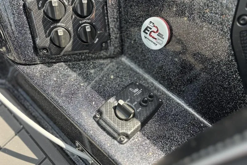 Slide: The Image of Control panel of 2026 Phoenix 920 Elite X boat with switches and labels. - 14
