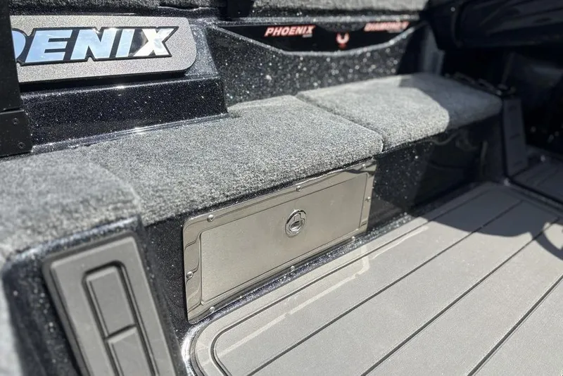 Slide: The Image of Interior of 2026 Phoenix 920 Elite X boat, featuring storage compartment and sleek design. - 17