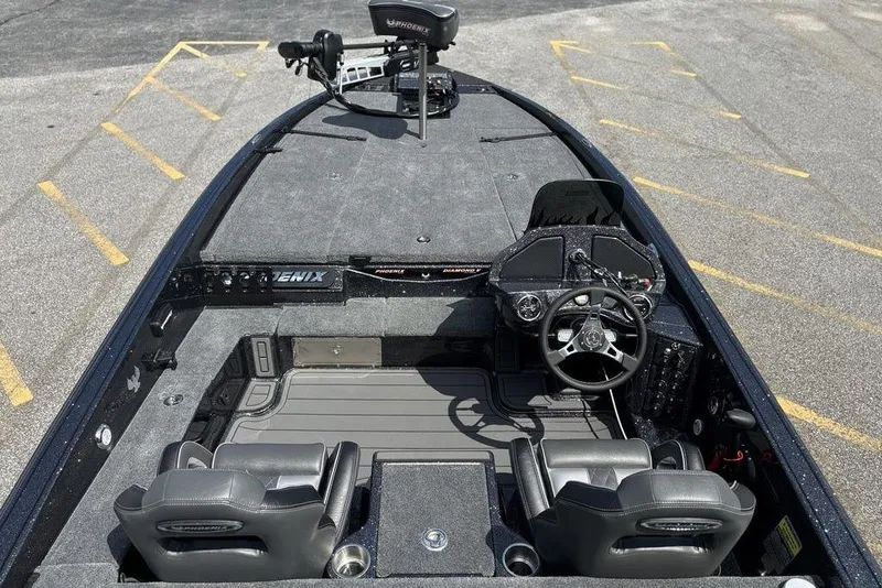 Slide: The Image of 2026 Phoenix 920 Elite X boat interior with steering wheel and seating. - 20