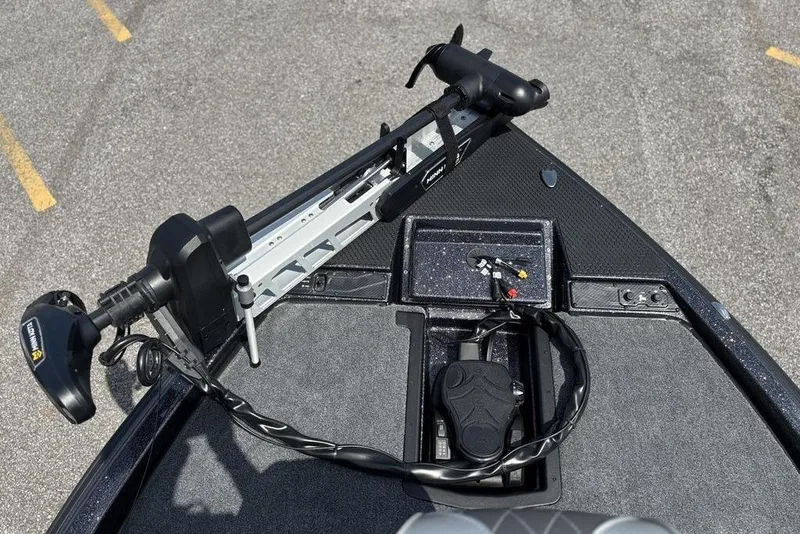 Slide: The Image of 2026 Phoenix 920 Elite X boat deck with trolling motor and control panel. - 21