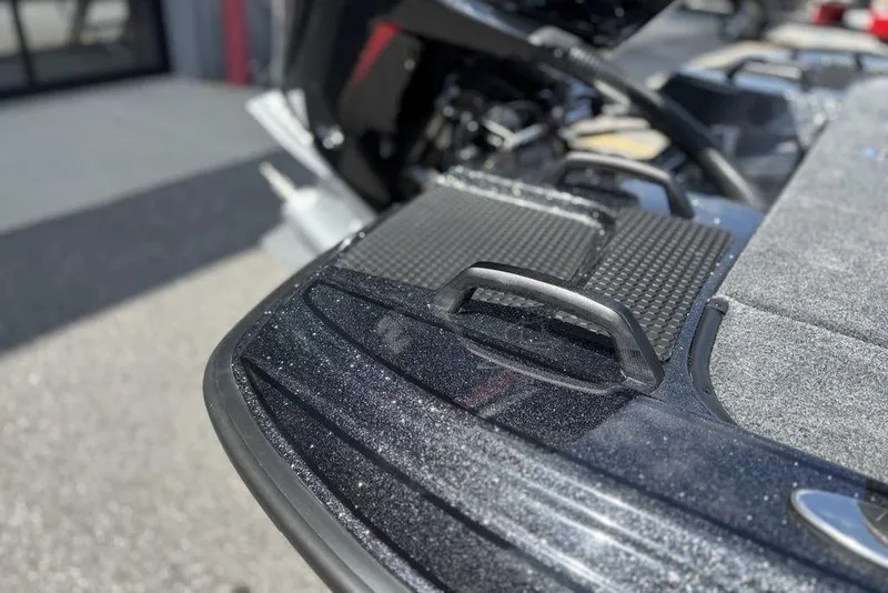 Slide: The Image of Close-up of 2026 Phoenix 920 Elite X boat deck with metallic finish and handle. - 22