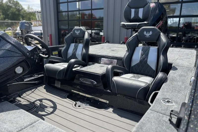 Slide: The Image of 2026 Phoenix 920 Elite X boat interior with sleek black and gray seating. - 7