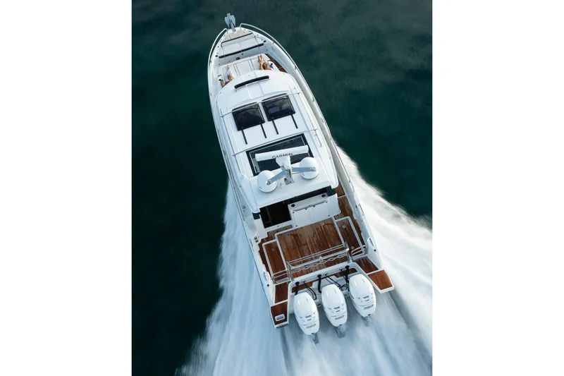 Slide: The Image of 2026 Wellcraft 38 Explorer boat cruising on a sunny day with twin engines. - 1