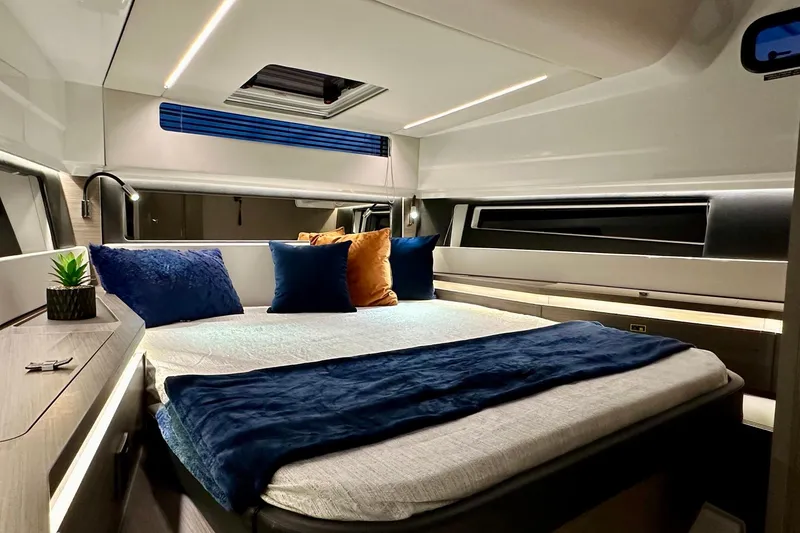 Slide: The Image of Interior of 2026 Wellcraft 38 Explorer boat with modern dashboard and seating. - 15