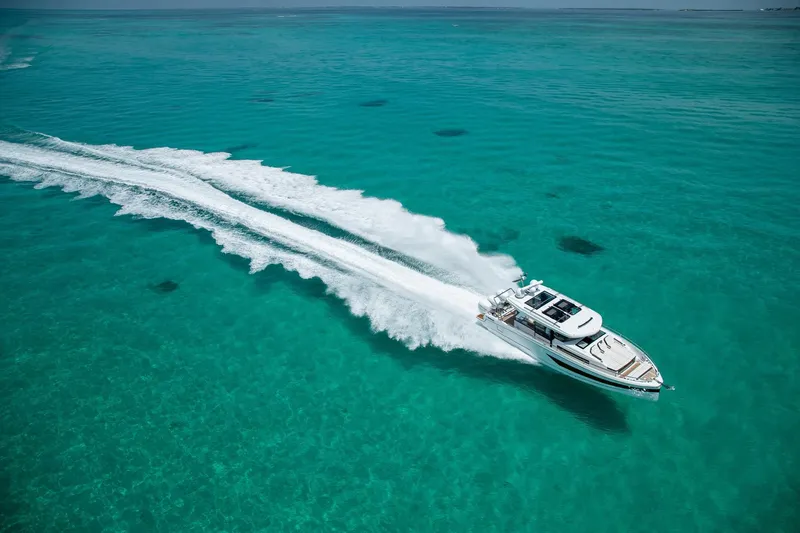 Slide: The Image of 2026 Wellcraft 38 Explorer boat anchor detail by the water. - 18