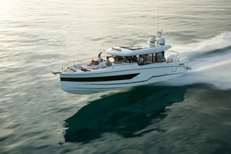 Slide: The Image of 2026 Wellcraft 38 Explorer boat docked on calm water, showcasing sleek design and modern features. - 19