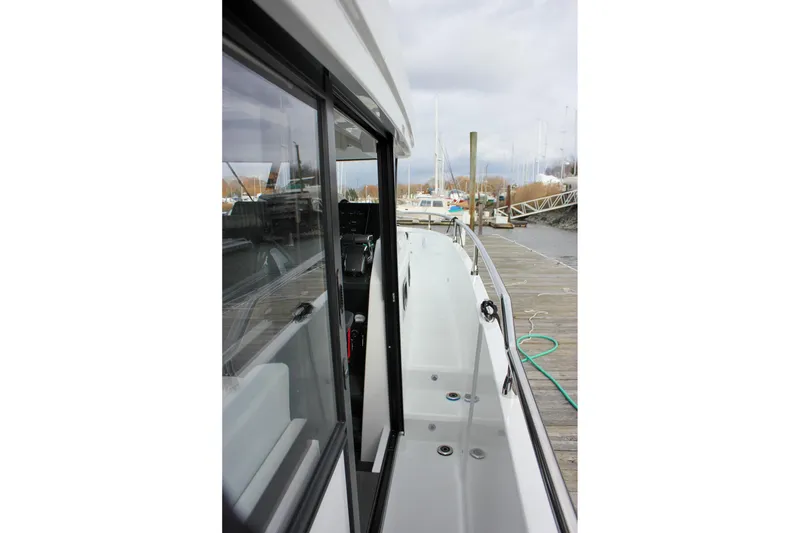 Slide: The Image of 2026 Wellcraft 38 Explorer docked, showcasing sleek side deck and modern design. - 22