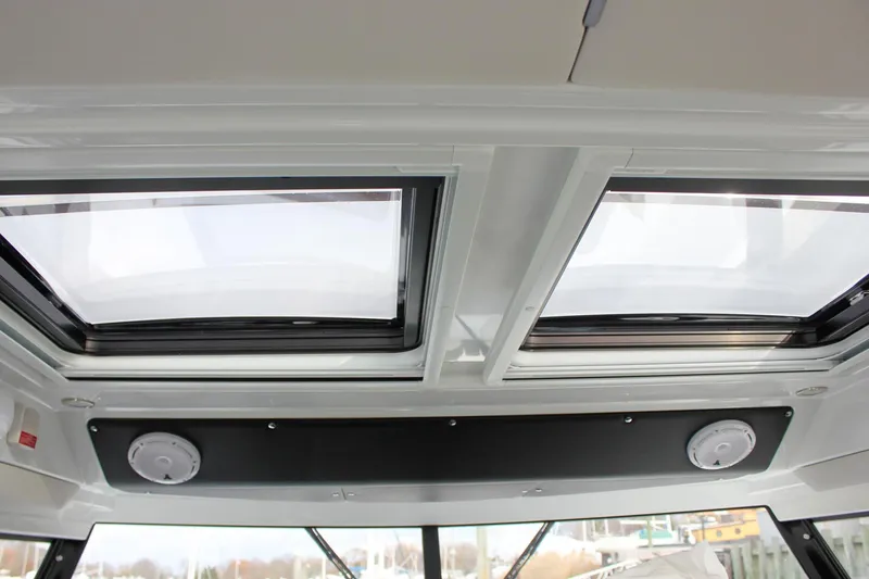 Slide: The Image of 2026 Wellcraft 38 Explorer boat interior with dual skylights and modern design. - 27