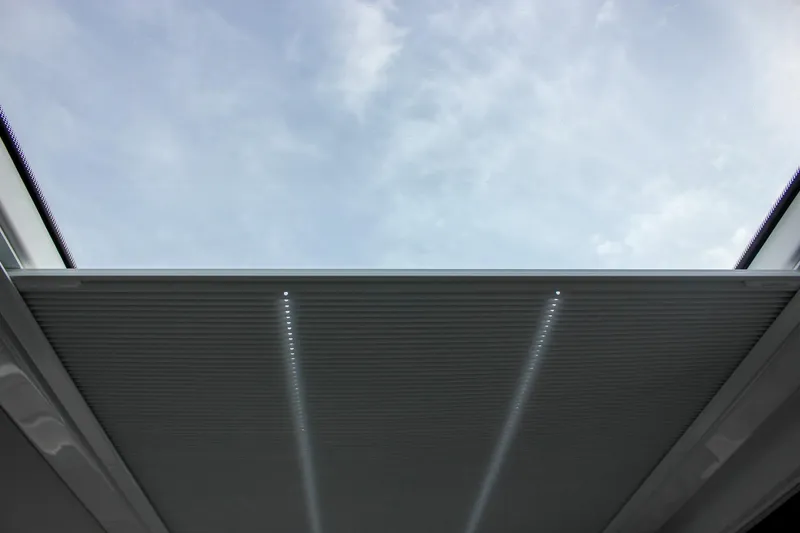 Slide: The Image of Skylight view from 2026 Wellcraft 38 Explorer, showcasing modern design and clear sky. - 29