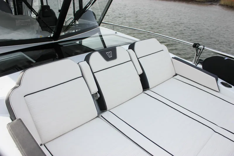 Slide: The Image of 2026 Wellcraft 38 Explorer boat with luxurious white seating on deck. - 38