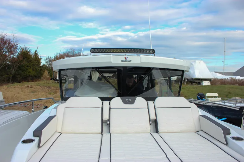Slide: The Image of 2026 Wellcraft 38 Explorer boat with sleek design and spacious seating. - 57