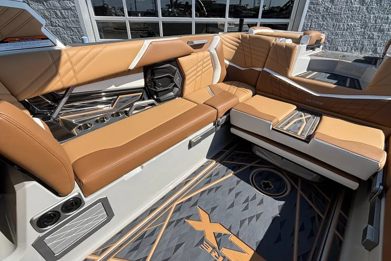 Slide: The Image of Luxurious interior of 2025 Tigé Ultré 25ZX boat with tan leather seating and modern design. - 17