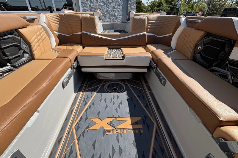 Slide: The Image of Luxurious interior of 2025 Tigé Ultré 25ZX boat with tan leather seating. - 18