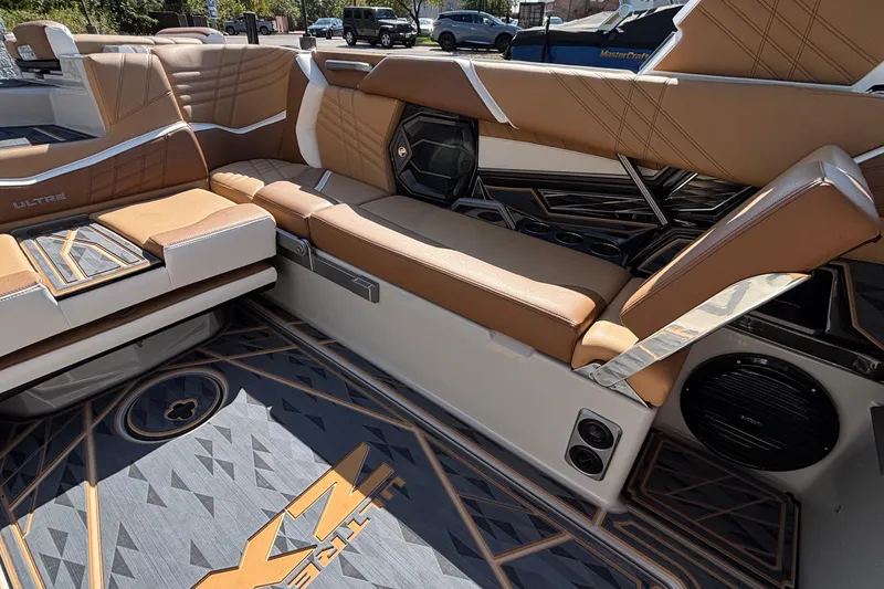 Slide: The Image of 2025 Tigé Ultré 25ZX boat interior with luxurious tan seating and modern design elements. - 19