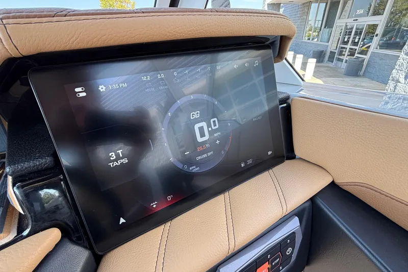 Slide: The Image of 2025 Tigé Ultré 25ZX dashboard display with digital controls and speedometer. - 21
