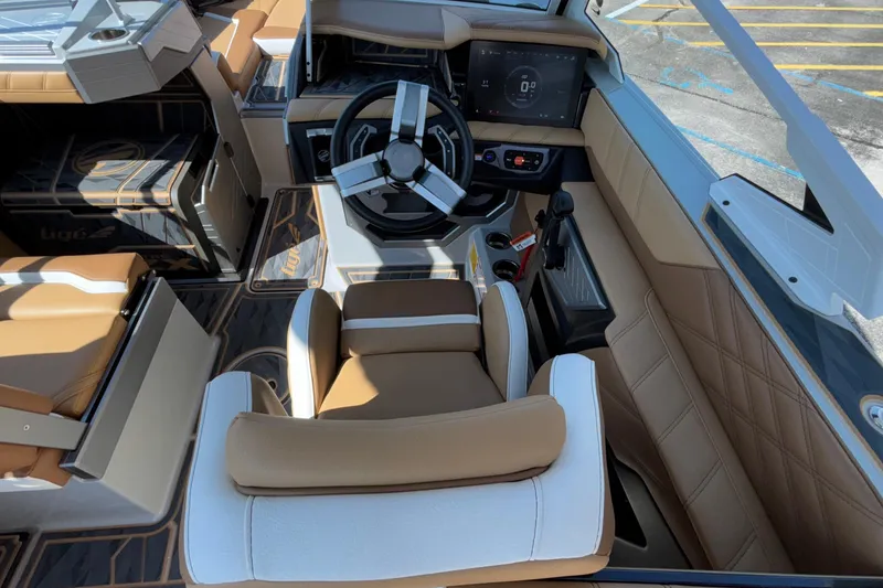 Slide: The Image of 2025 Tigé Ultré 25ZX boat interior with modern steering and dashboard design. - 22
