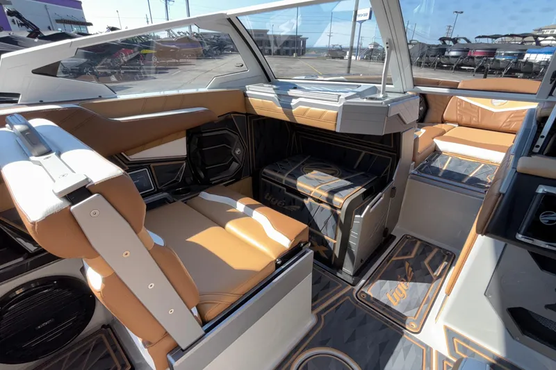 Slide: The Image of 2025 Tigé Ultré 25ZX boat interior with luxurious seating and modern design. - 23
