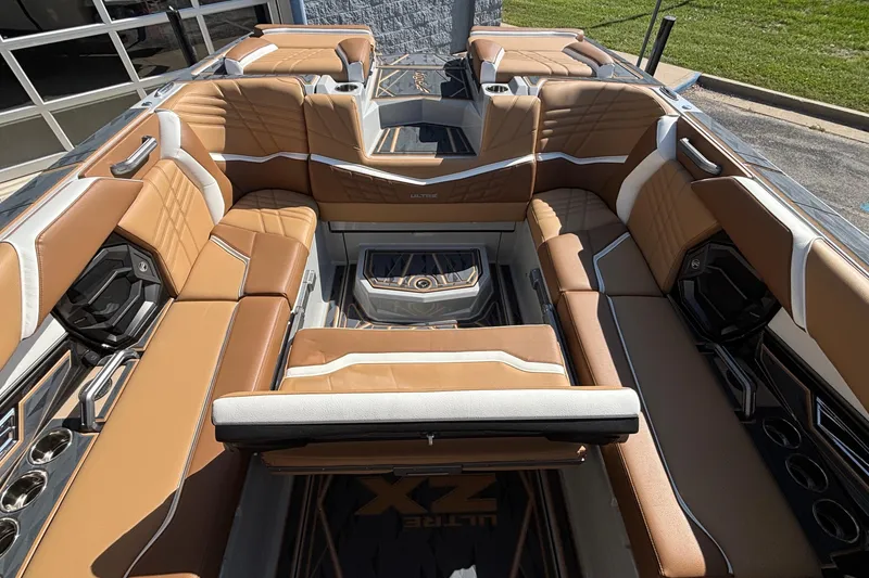 Slide: The Image of 2025 Tigé Ultré 25ZX boat interior with luxurious tan seating and modern design. - 31