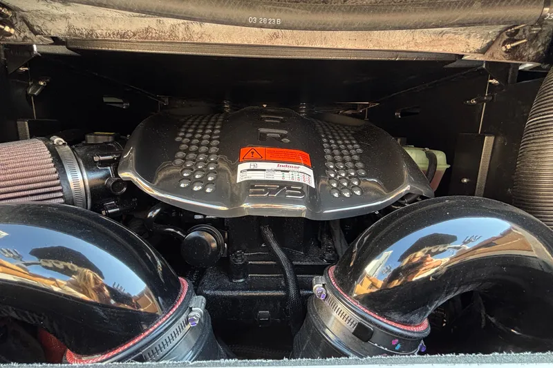 Slide: The Image of 2025 Tigé Ultré 25ZX engine compartment with Indmar 6.2L V8 engine components. - 36