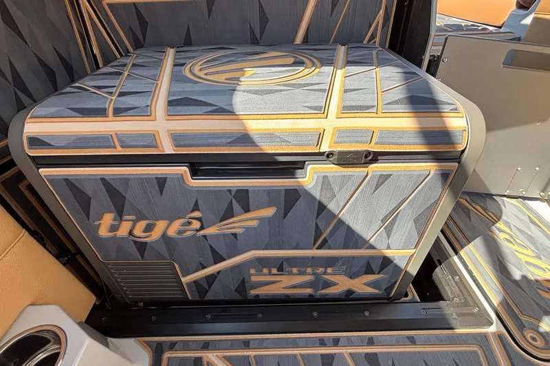 Slide: The Image of 2025 Tigé Ultré 25ZX boat interior with stylish geometric design and branding. - 41