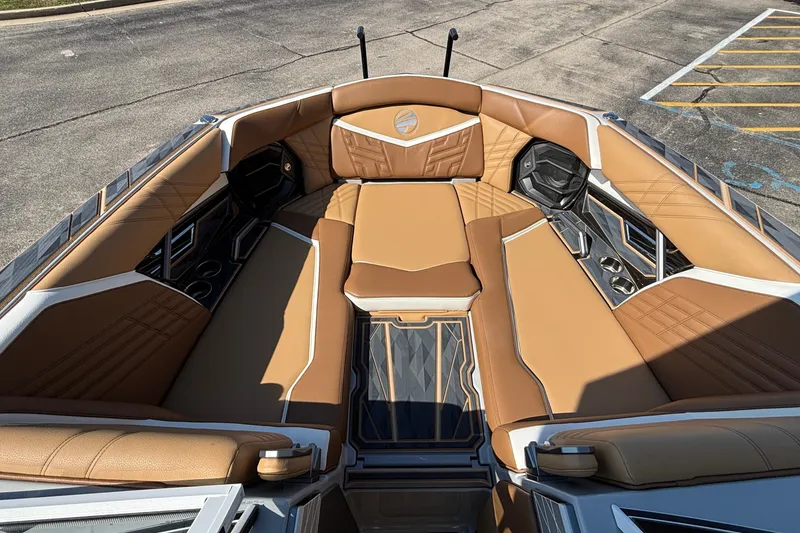 Slide: The Image of 2025 Tigé Ultré 25ZX boat interior with luxurious tan seating and modern design. - 44