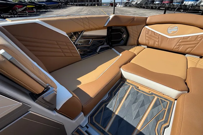 Slide: The Image of Luxurious interior of 2025 Tigé Ultré 25ZX boat with tan leather seating. - 45